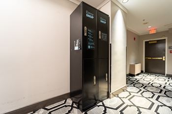 two black elevators in the lobby of a building at West End Residences, Washington, Washington